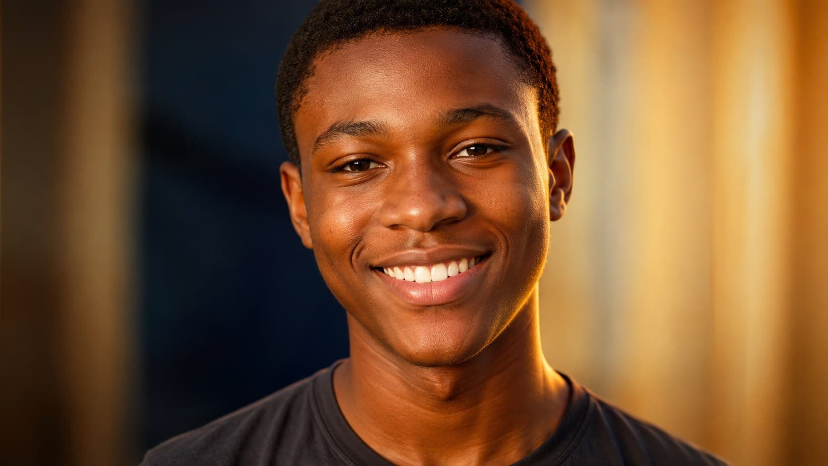 A confident Nigerian teenager smiling, looking directly ahead